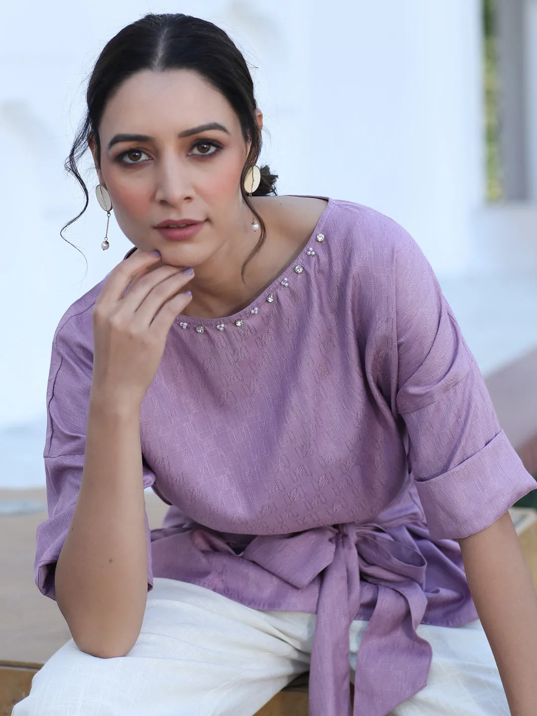 A Mauve Color Self Weaved Embellished Top With Tie-Up At The Waist And Extended Sleeves