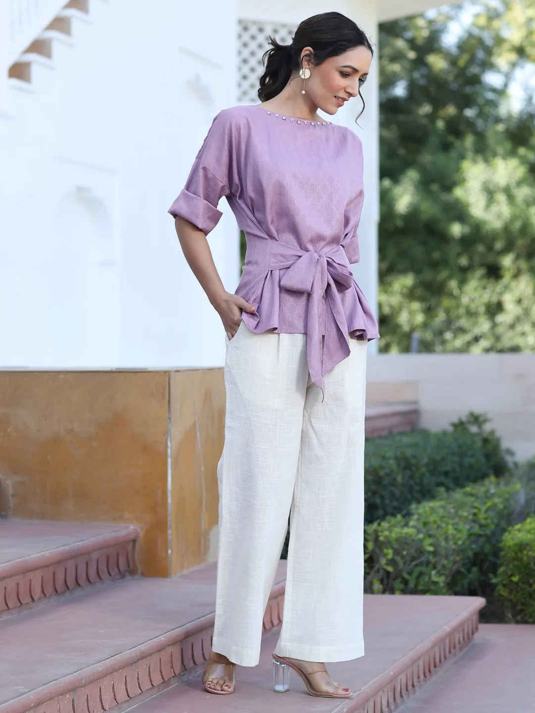A Mauve Color Self Weaved Embellished Top With Tie-Up At The Waist And Extended Sleeves