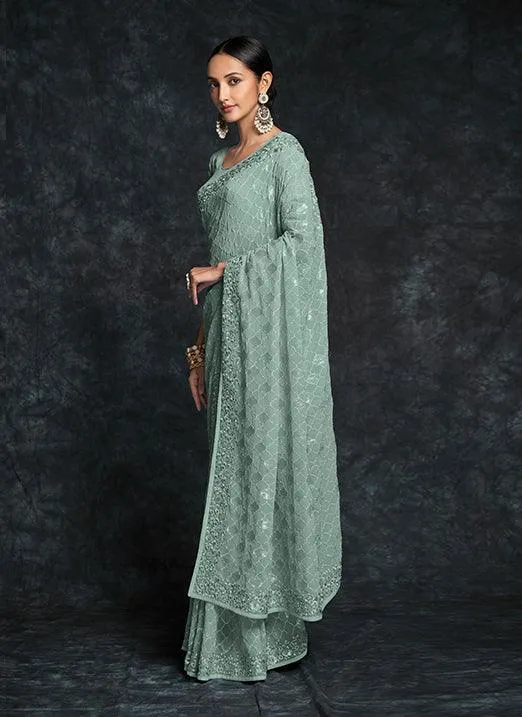 Mesmerizing Pista Green Georgette Saree with Heavy Embroidery